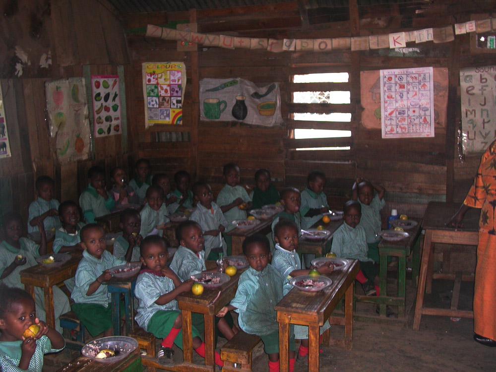 Muhada: Orphans, many infected with HIV, enjoying class. Muhada: Orphans, many infected with HIV, enjoying class.